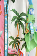Load image into Gallery viewer, Introducing the Paradise Inn Set, featuring a printed short sleeve button-down shirt paired with chic wide-leg matching pants. Designed for comfort, the pants boast a drawstring waist. The vibrant print captures the essence of paradise, with palm trees, flamingos, and tropical colors creating an intoxicating allure. Perfect for those seeking a fun and stylish ensemble.
