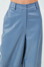 Load image into Gallery viewer, Introducing our Dusty Blue Loose Fit Vegan Leather Pants—a perfect blend of style and comfort. Crafted from high-quality vegan leather, these pants offer a soft, supple feel with a chic, relaxed silhouette. The loose fit provides ease of movement, making them ideal for both casual outings and dressed-up occasions. The unique dusty blue hue adds a modern twist to classic leather pants, ensuring you stand out in any crowd. 
