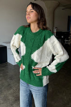 Load image into Gallery viewer, Wrap yourself in cozy style with this Green &amp; Cream Color Block Knit Sweater. Designed with a relaxed fit and a classic crew neck, it features a soft, medium-weight cable knit that adds texture and warmth. The all-over color block pattern offers a modern twist on a timeless piece, making it an effortless addition to any casual outfit. True to size, this sweater is perfect for layering or wearing solo for a chic, laid-back look.
