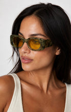 Load image into Gallery viewer, Olive tortoise rectangular sunglasses with chunky frame and yellow tinted lenses, shown on a model and on a white background.
