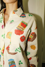Load image into Gallery viewer, Cream-colored button-up shirt with colorful grocery and snack print, featuring short sleeves and a relaxed fit - perfect for playful summer style. Matching printed shorts sold separately. Fun, foodie-inspired fashion exclusively at Glam Expressway.
