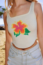 Load image into Gallery viewer, Elevate your wardrobe with our Cream Hibiscus Knit Crop Tank Top, featuring an exclusive hand-drawn intarsia design. This unique piece combines artistry and comfort, making it a standout addition to any collection. This tank top seamlessly blends style and craftsmanship, offering a fresh take on knitwear that&#39;s both fashionable and functional.
