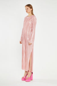 Step into timeless elegance with our Pink Plisse Maxi Dress. This stunning piece features long sleeves and a beautifully textured plisse fabric that drapes effortlessly. Its retro-inspired design exudes femininity, making it perfect for both day and evening occasions. Whether you're attending a garden party or a chic dinner, this dress ensures you make a graceful statement every time.