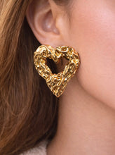 Load image into Gallery viewer, Textured gold heart-shaped statement stud earrings with sculptural molten finish.
