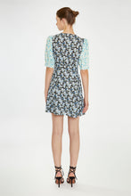 Load image into Gallery viewer, Step into summer with this adorable floral dress, featuring contrasting floral prints for a chic, 90s-inspired look. With its short sleeves, flattering V neckline, and a hem that falls just above the knee, it&#39;s perfect for any warm-weather occasion. Pair it with cowboy boots for a stylish upgrade or keep it casual with your favorite sneakers. Stay cute and on trend all season long!
