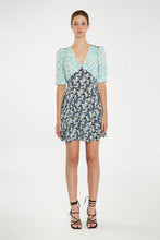 Load image into Gallery viewer, Step into summer with this adorable floral dress, featuring contrasting floral prints for a chic, 90s-inspired look. With its short sleeves, flattering V neckline, and a hem that falls just above the knee, it&#39;s perfect for any warm-weather occasion. Pair it with cowboy boots for a stylish upgrade or keep it casual with your favorite sneakers. Stay cute and on trend all season long!
