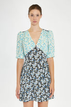 Load image into Gallery viewer, Step into summer with this adorable floral dress, featuring contrasting floral prints for a chic, 90s-inspired look. With its short sleeves, flattering V neckline, and a hem that falls just above the knee, it&#39;s perfect for any warm-weather occasion. Pair it with cowboy boots for a stylish upgrade or keep it casual with your favorite sneakers. Stay cute and on trend all season long!
