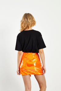 Glam Expressway has all the glam fashion you need! Like our Orange Sequin Mini Skirt. This bright orange sequin skirt is fully lined and hangs to the mid thigh with a draped fabric detail making this fun skirt unique and eye catching. This gorgeous skirt is perfect for the holiday season with a fresh pop of color.   Style Tip: Wear our Orange Sequin Mini Skirt with a graphic tee for a fun street style look. Pair it with a chic button down blouse and heels for a more sophisticated look. 