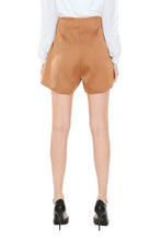 Load image into Gallery viewer, These champagne colored silky shorts are the perfect addition to your wardrobe. The v-cut waist and rhinestone details make this a timeless classic that you are sure to wear again and again. Our Beige Crystal Shorts are excellent quality with pleated pockets and full lining! There is no doubt that you will feel confident and beautiful wearing these dressy shorts. 

