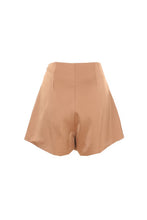 Load image into Gallery viewer, These champagne colored silky shorts are the perfect addition to your wardrobe. The v-cut waist and rhinestone details make this a timeless classic that you are sure to wear again and again. Our Beige Crystal Shorts are excellent quality with pleated pockets and full lining! There is no doubt that you will feel confident and beautiful wearing these dressy shorts. 
