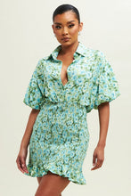 Load image into Gallery viewer, Our blue and green Floral Smocked Shirt Dress is fun, chic and feminine. This sweet dress features a collared neck, button closure, a decorative smocked skirt with a pretty frill at the hem, and is sure to become one of your go-to favorites! Dress it up or down!
