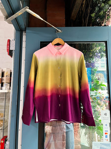 Glam Expressway's Dip Dyed Ombre button down shirt is chic, elegant and sophisticated. This unique blouse has a shirt collar, long sleeves and a button closure. With a unique and beautiful ombre print in light pink, olive green and burgundy red.  Style Tip: Wear Glam Expressway's Dip Dyed Ombre Shirt for work or play with wide leg pants, denim or shorts. Either way, this chic print stands out. 