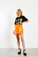 Load image into Gallery viewer, Glam Expressway has all the glam fashion you need! Like our Orange Sequin Mini Skirt. This bright orange sequin skirt is fully lined and hangs to the mid thigh with a draped fabric detail making this fun skirt unique and eye catching. This gorgeous skirt is perfect for the holiday season with a fresh pop of color.   Style Tip: Wear our Orange Sequin Mini Skirt with a graphic tee for a fun street style look. Pair it with a chic button down blouse and heels for a more sophisticated look. 
