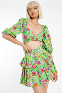 A bright and colorful crop top to give you a playful boho look. This green floral blouse features beautiful flowers that burst in every color of the rainbow. This top is fun and makes resort wear interesting! Perfect to wear with flats or sandals, A must-have item for summer vacations and cookouts! Matching top skirt separately.