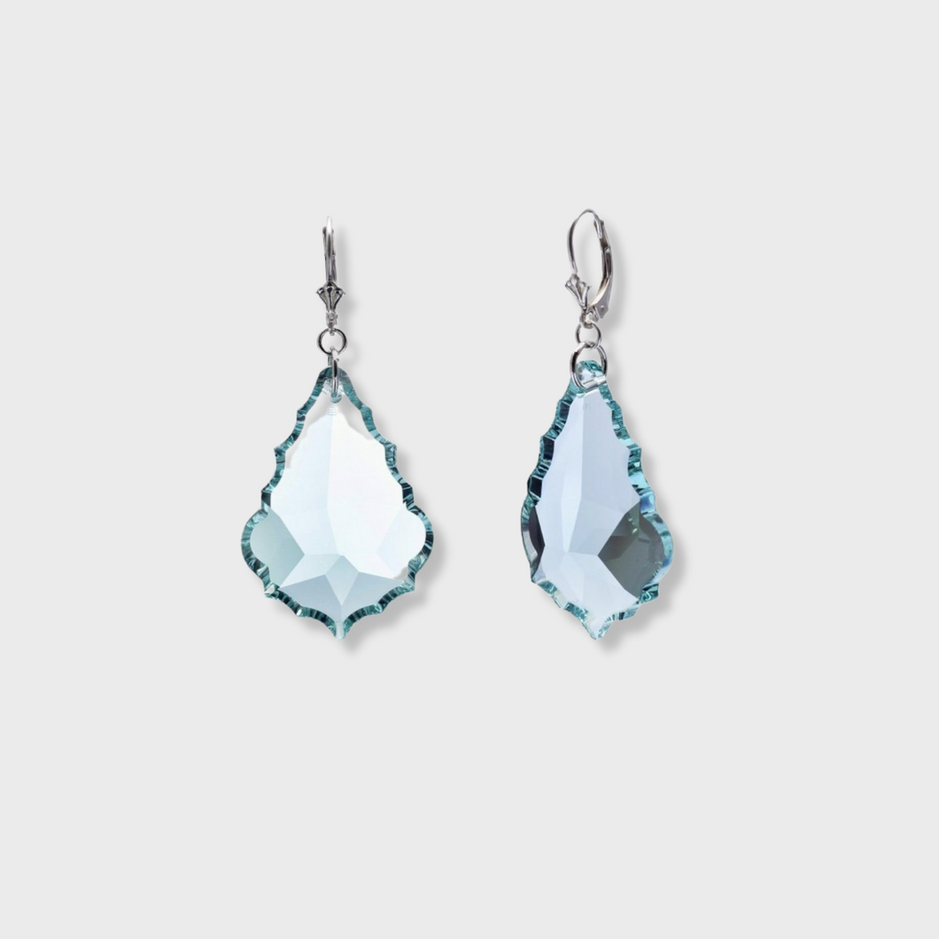 These exquisite Swarovski Crystal Earrings were literally fashioned from vintage chandeliers. They are light weight and come in aquamarine, clear and purple. The Vintage Swarovski Earrings are hand made and sold exclusively on Glam Expressway.