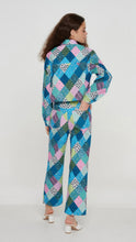 Load image into Gallery viewer, Our fun Patchwork Trousers will brighten up your life. Slightly cropped denim printed trousers with a blue, pink, lavender and green patchwork design have a straight leg fit. Matching shacket sold separately. This set was made from recycled fabrics! Dress them up or down!
