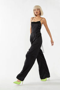 Solve your what-to-wear problem with the elegant and chic black jumpsuit, for every occasion. This open-back design features wide legs that flow beautifully when you walk, and a flattering fit that touches all the right places on your figure.
