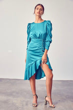 Load image into Gallery viewer, Our gorgeous jewel toned Bow Tie Dress has a retro chic style. Puffed sleeves, an asymmetrical ruffled hem and the sweetest open back design with a sweet and feminine bow. The details make this beautiful dress stand out! Model pictured is wearing a size small.
